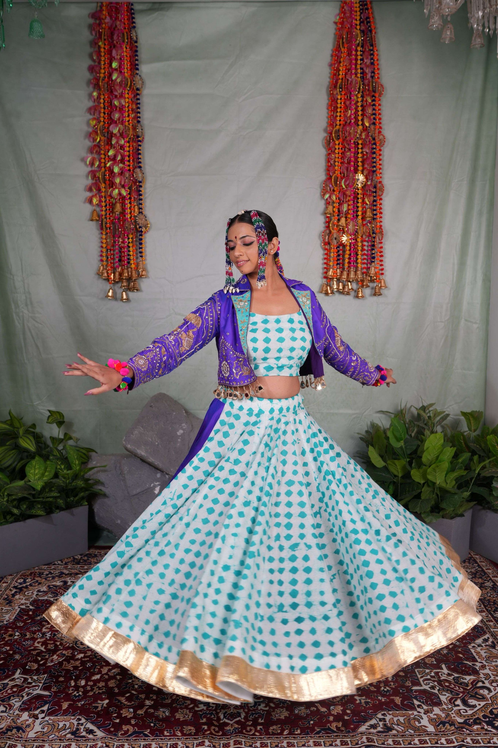 Printed flared lehenga with hand embroidered jacket with mirror latkans