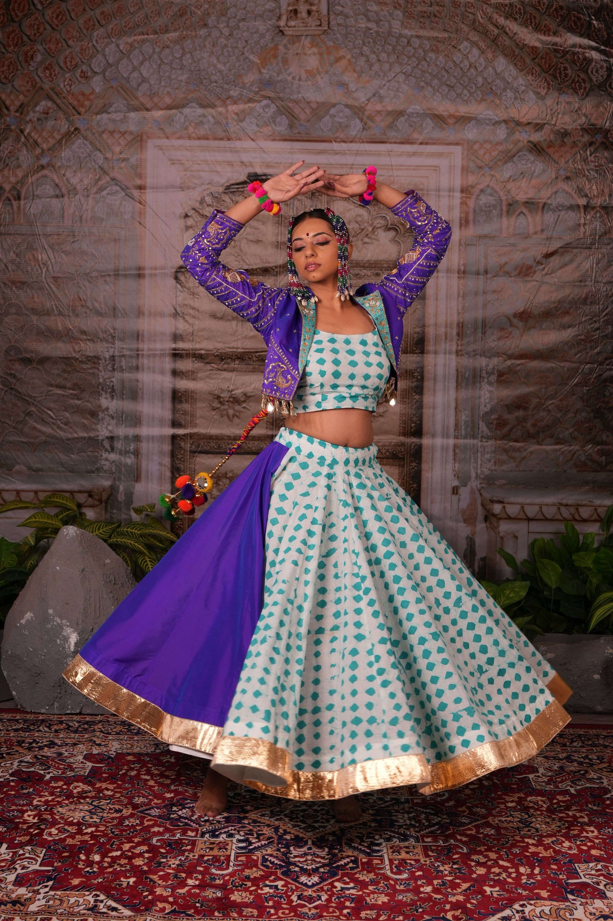 Printed flared lehenga with hand embroidered jacket with mirror latkans