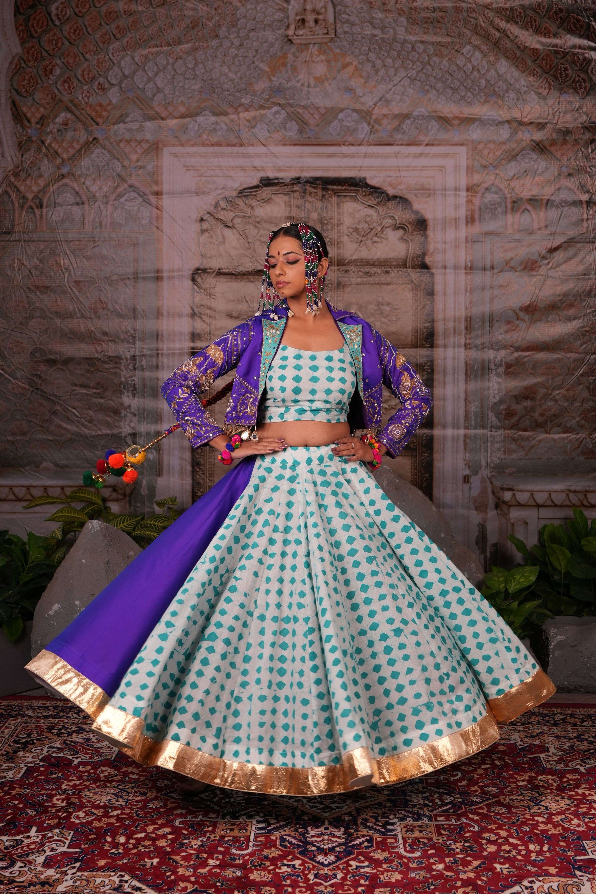 Printed flared lehenga with hand embroidered jacket with mirror latkans