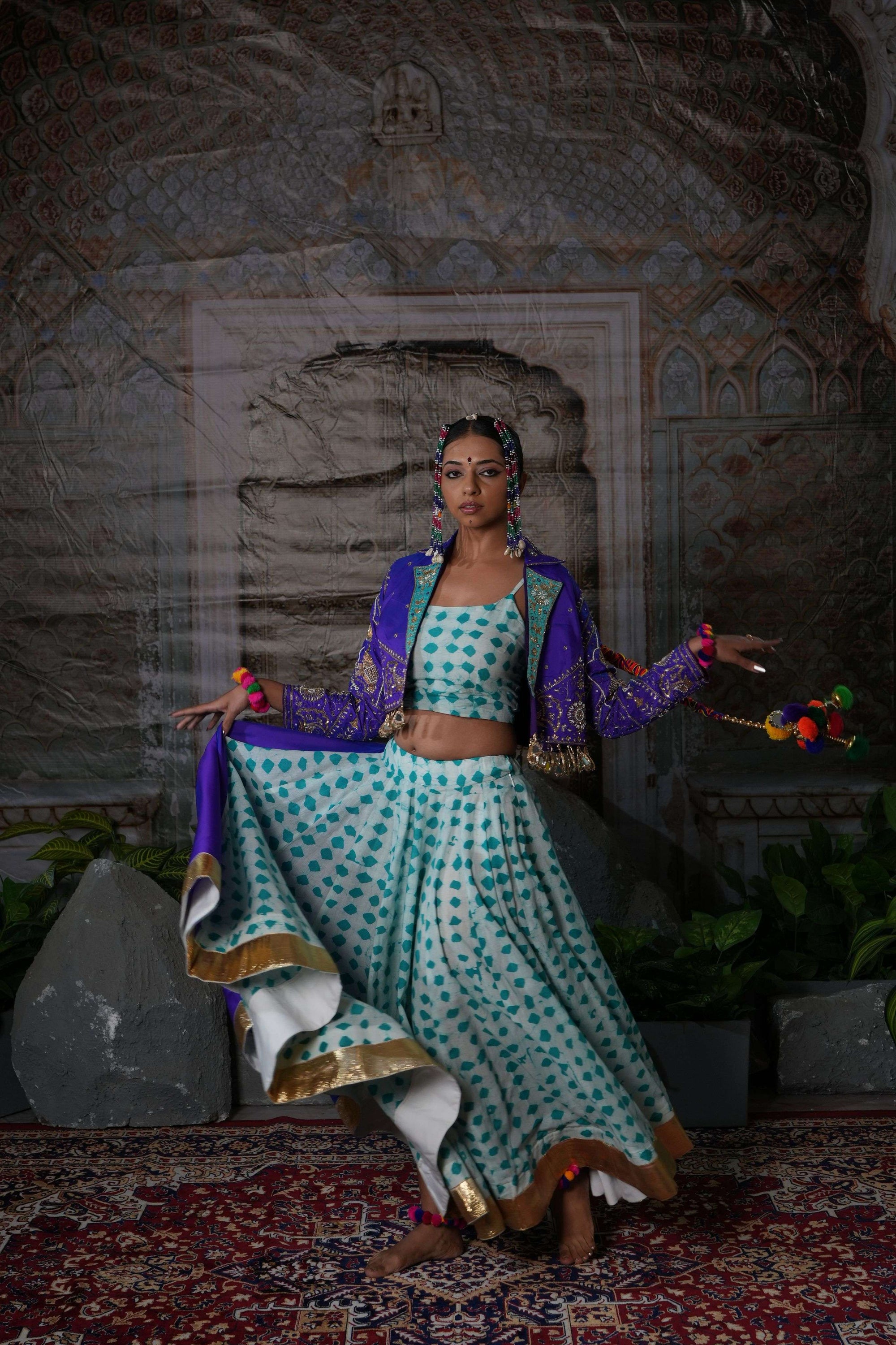 Printed flared lehenga with hand embroidered jacket with mirror latkans
