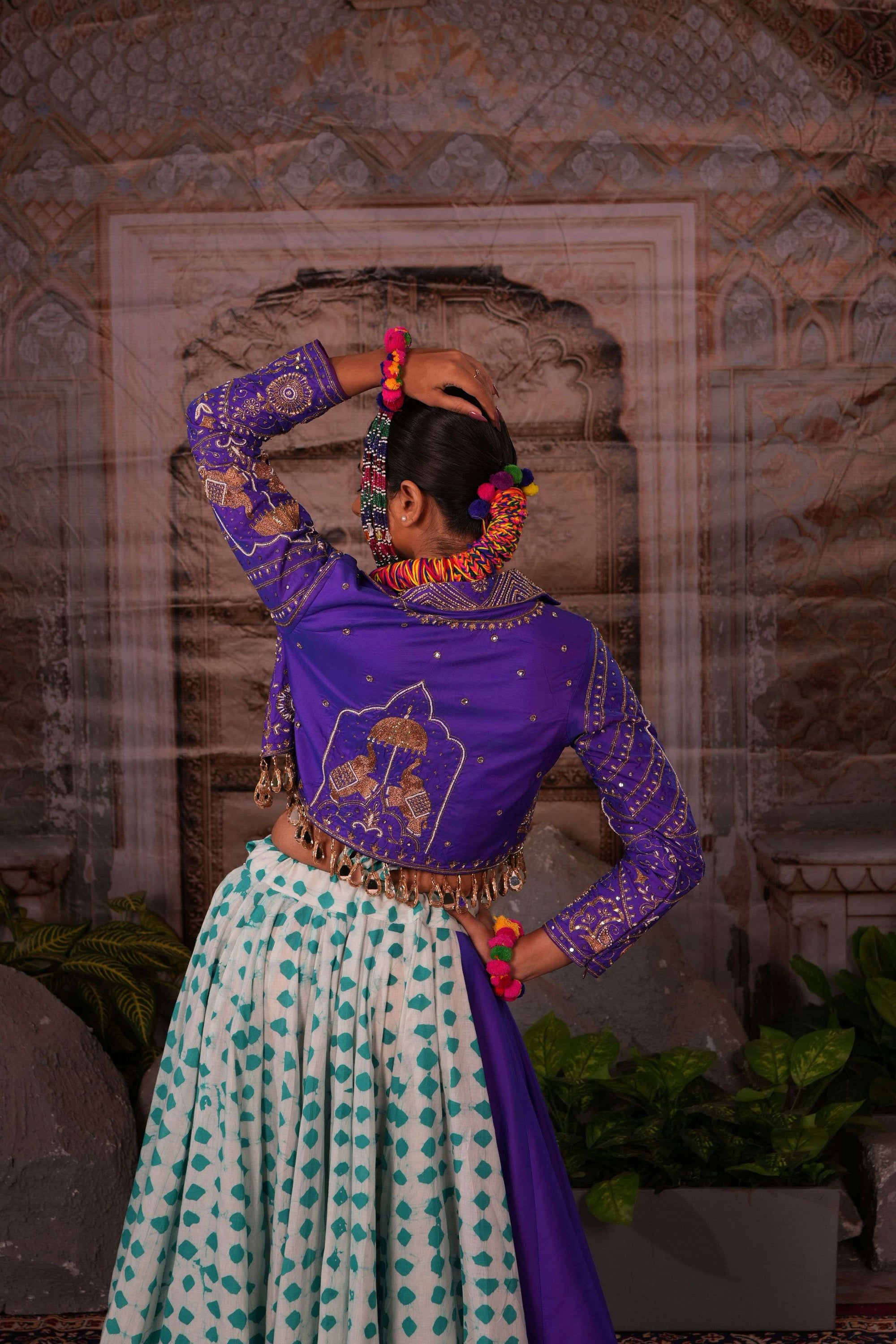 Printed flared lehenga with hand embroidered jacket with mirror latkans