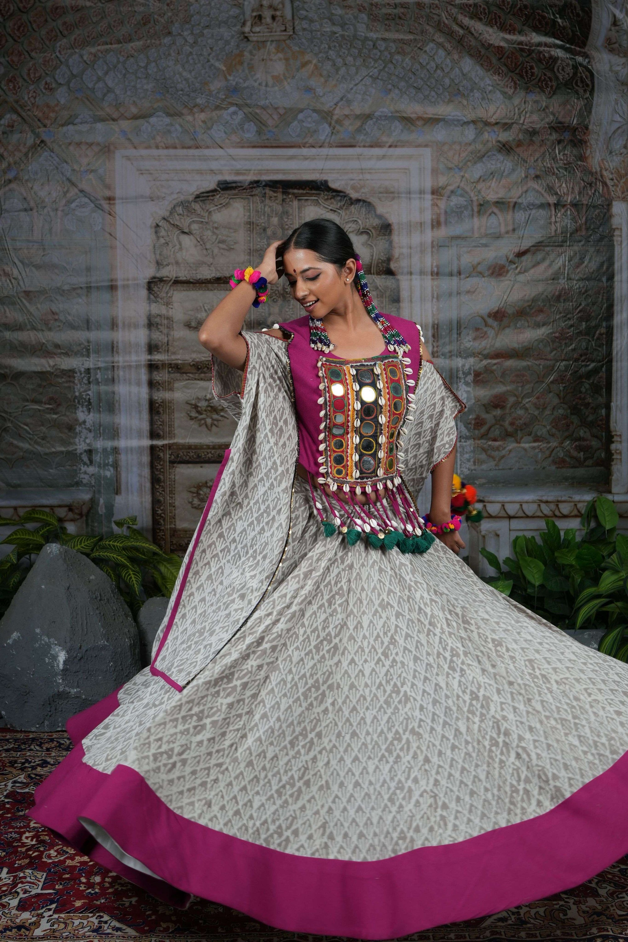 Tribal mirror work adjustable cape top with flared printed lehenga