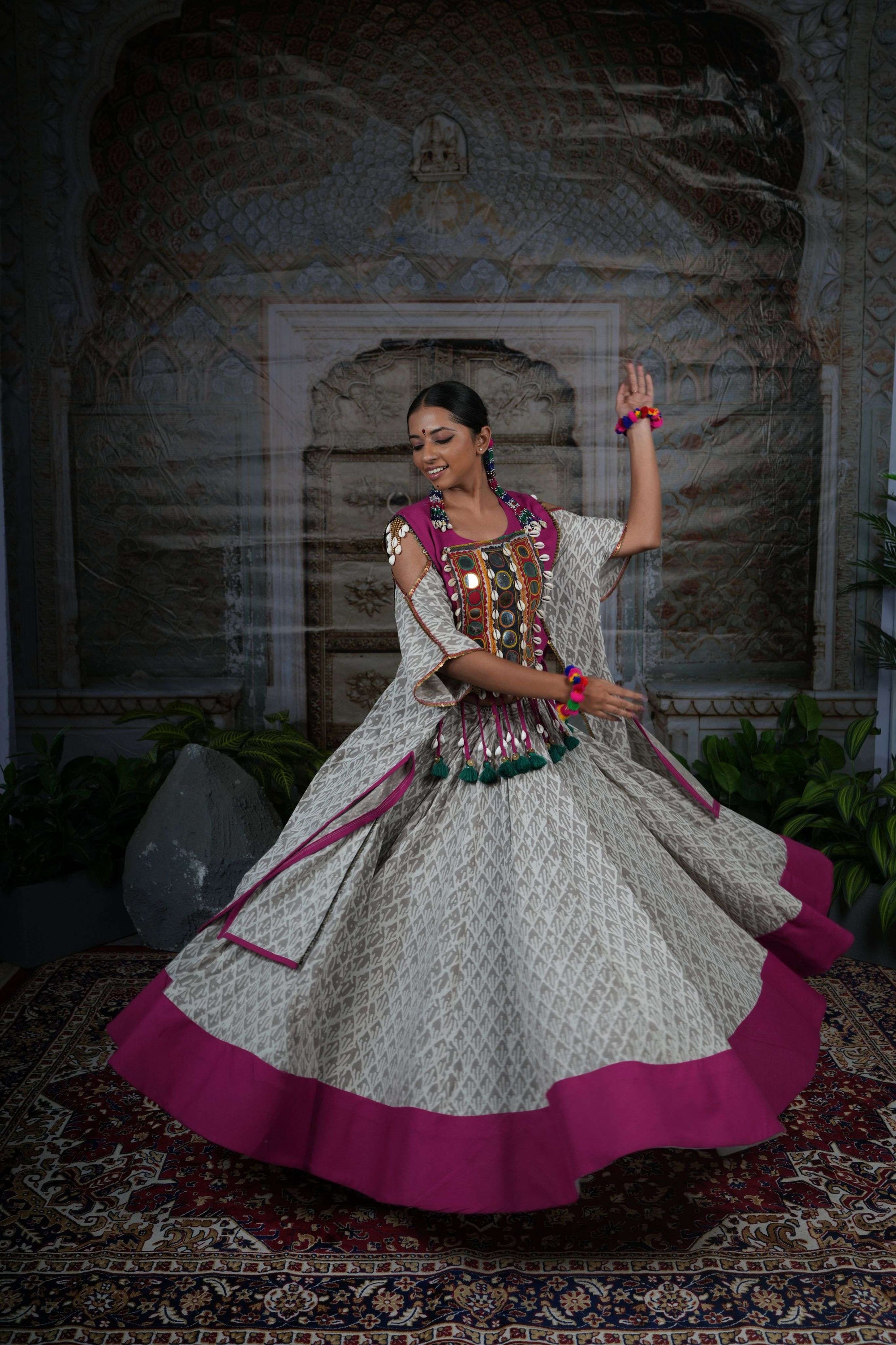 Tribal mirror work adjustable cape top with flared printed lehenga